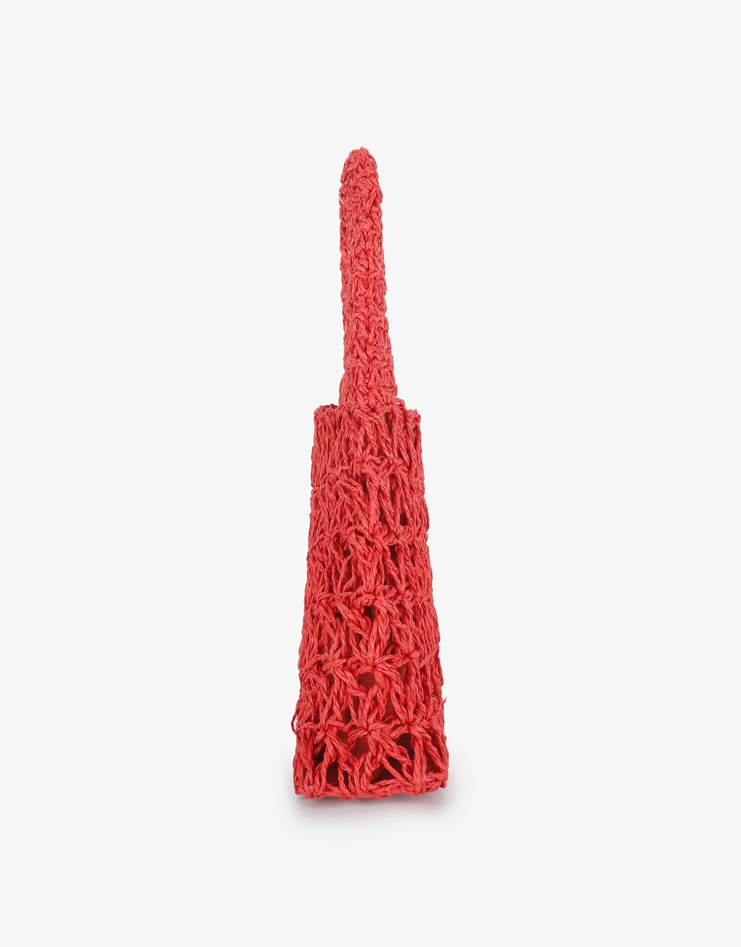 Red open weave crochet tote in side profile by Remi and Reid.