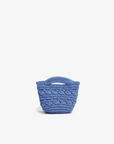 A small blue crocheted tote bag with a solid blue crocheted pattern by Remi and Reid.