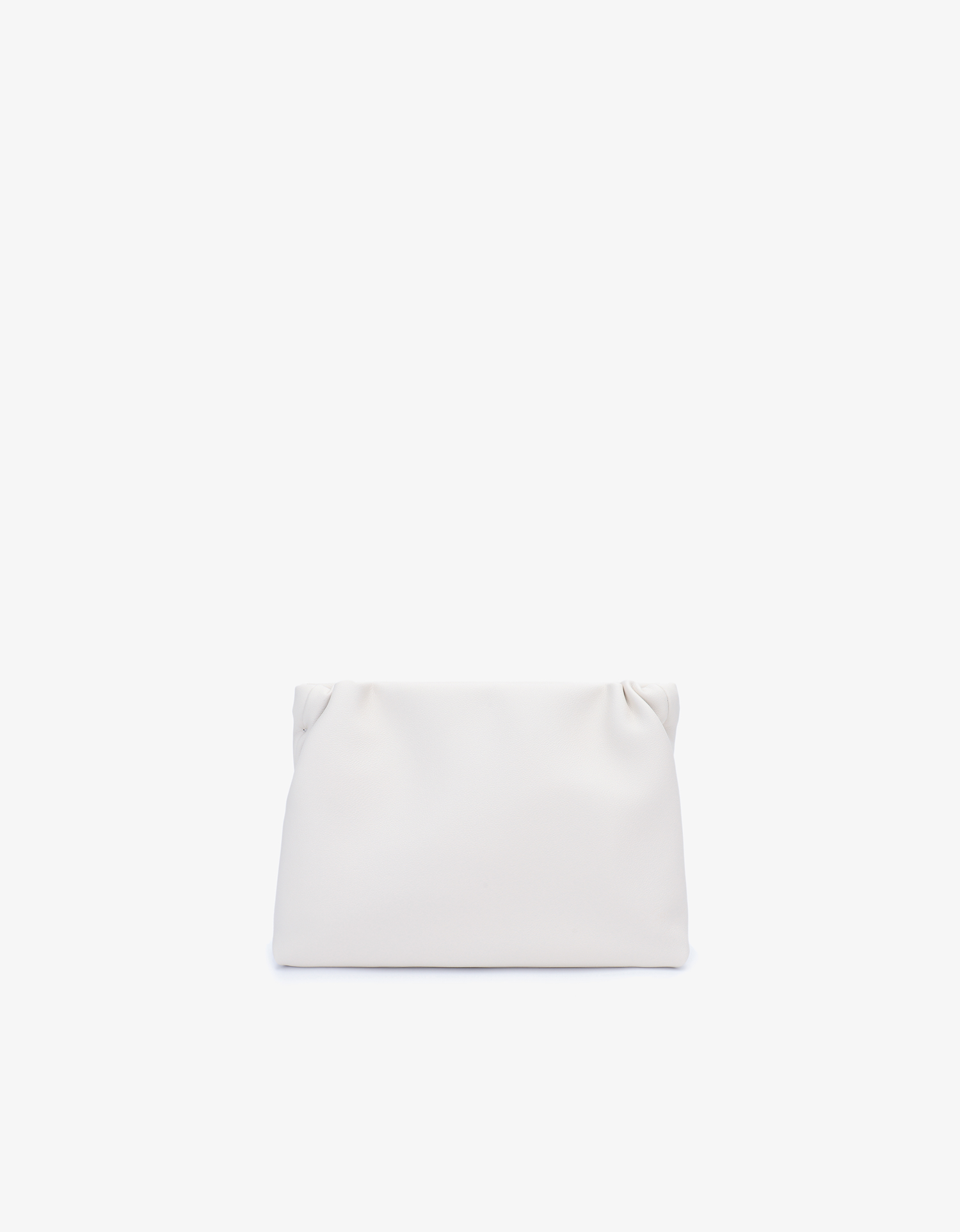A cream-colored clutch with a crossbody strap, featuring a frame closure and light gold hardware by Remi and Reid.