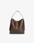 Waxed vegan leather shoulder bag in espresso brown featuring a wide single strap handle and gold-tone buckle hardware on the side by Remi and Reid.