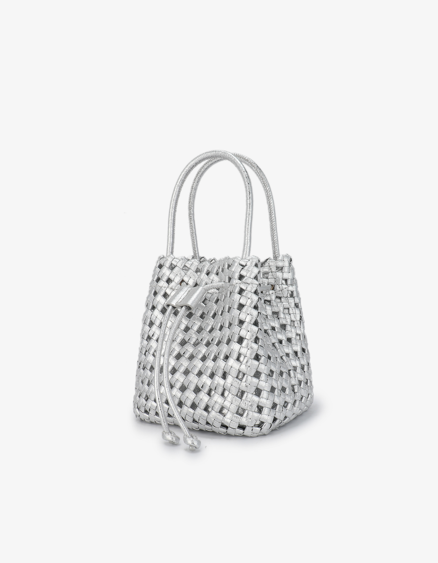Front shot of a metallic silver woven square tote by Remi and Reid with drawstring closure and top handles.