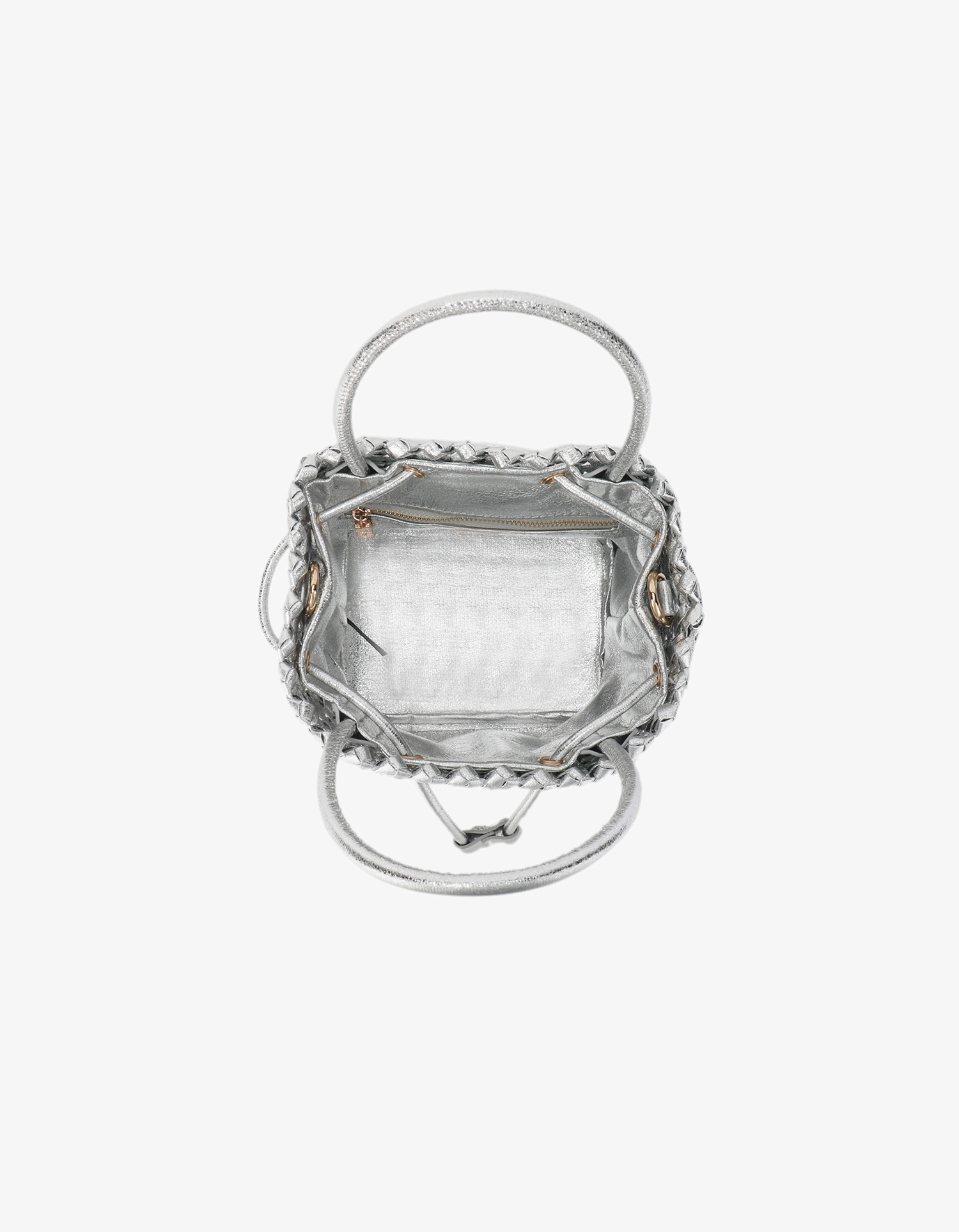 Top-down view into the Perrie Bucket Mini by Remi and Reid showing a square metallic silver woven vegan leather interior.