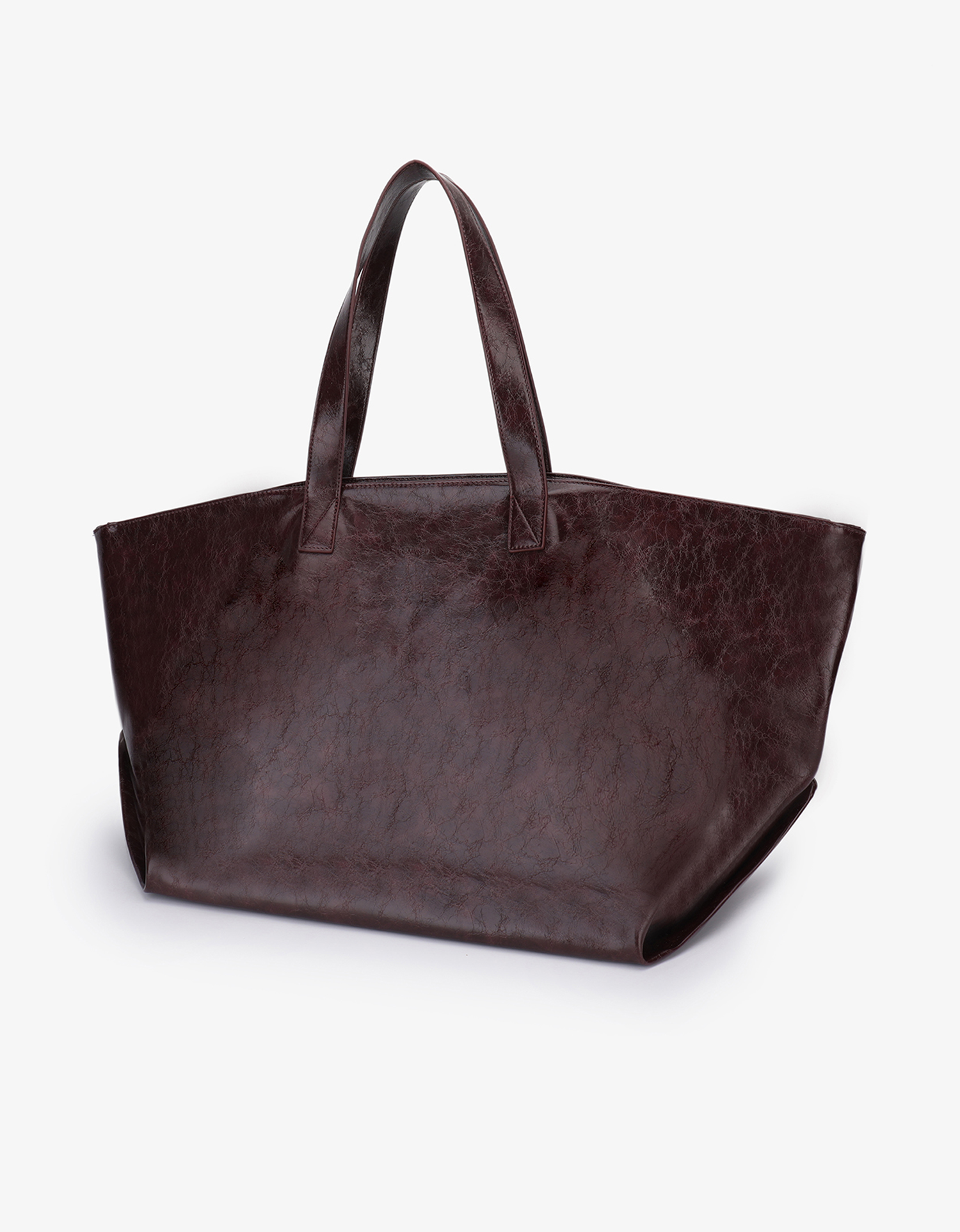 Extra Large Plaisir Tote by Remi and Reid in a deep oxblood red waxed vegan leather with a high-shine, crinkled texture.