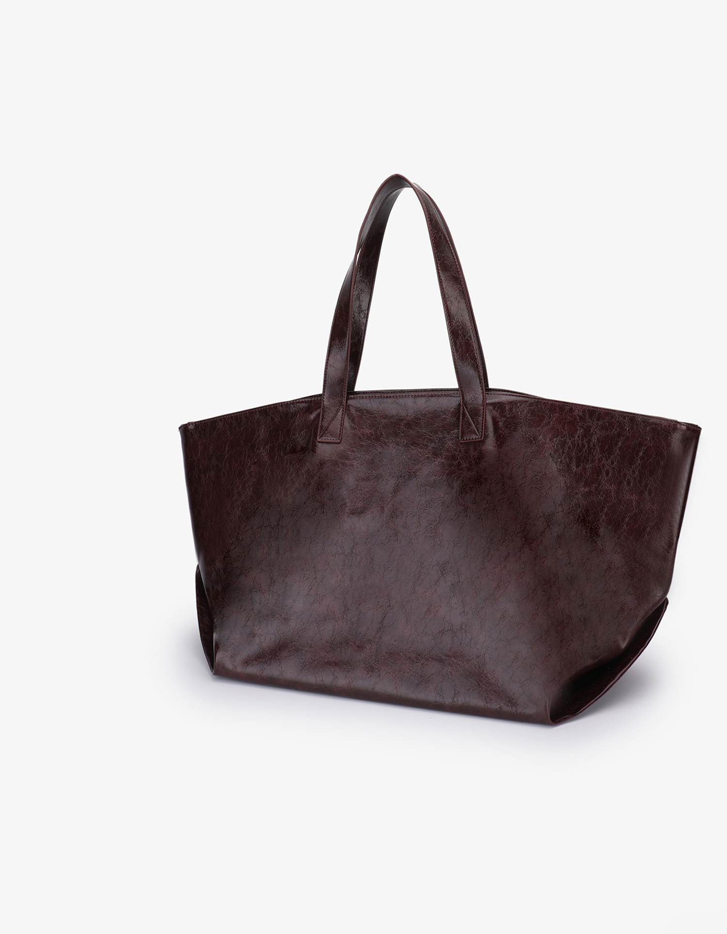 Extra Large Plaisir Tote by Remi and Reid in a deep oxblood red waxed vegan leather with a high-shine, crinkled texture.