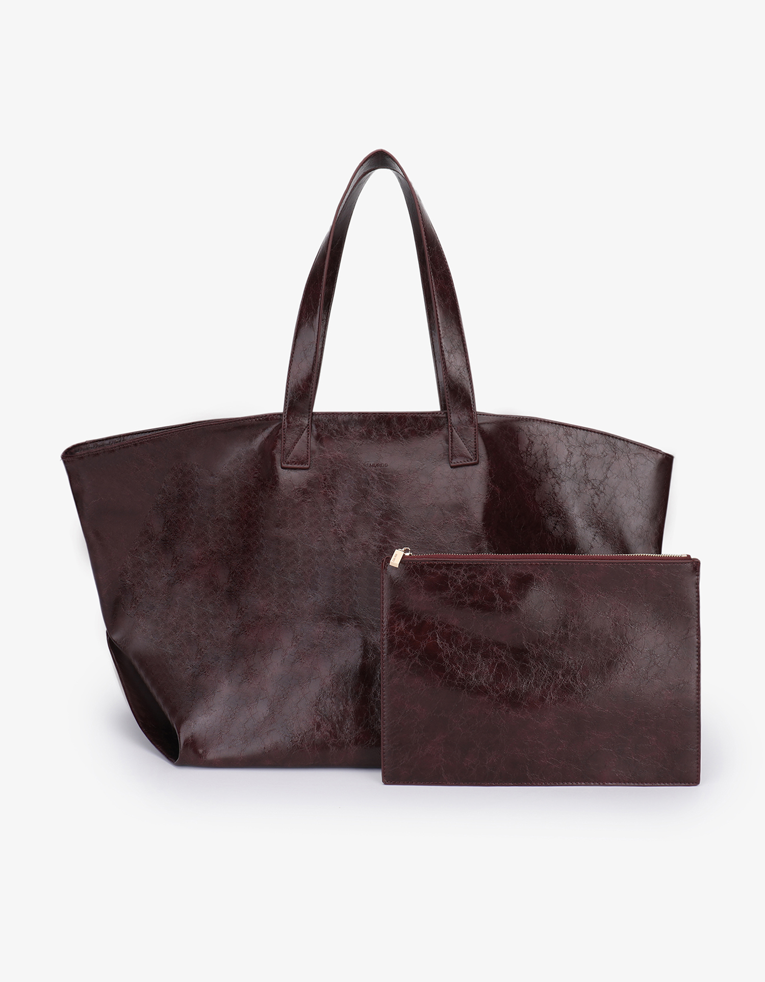 Extra Large Plaisir Tote by Remi and Reid in a deep oxblood red waxed vegan leather with a high-shine, crinkled texture with matching pouch.
