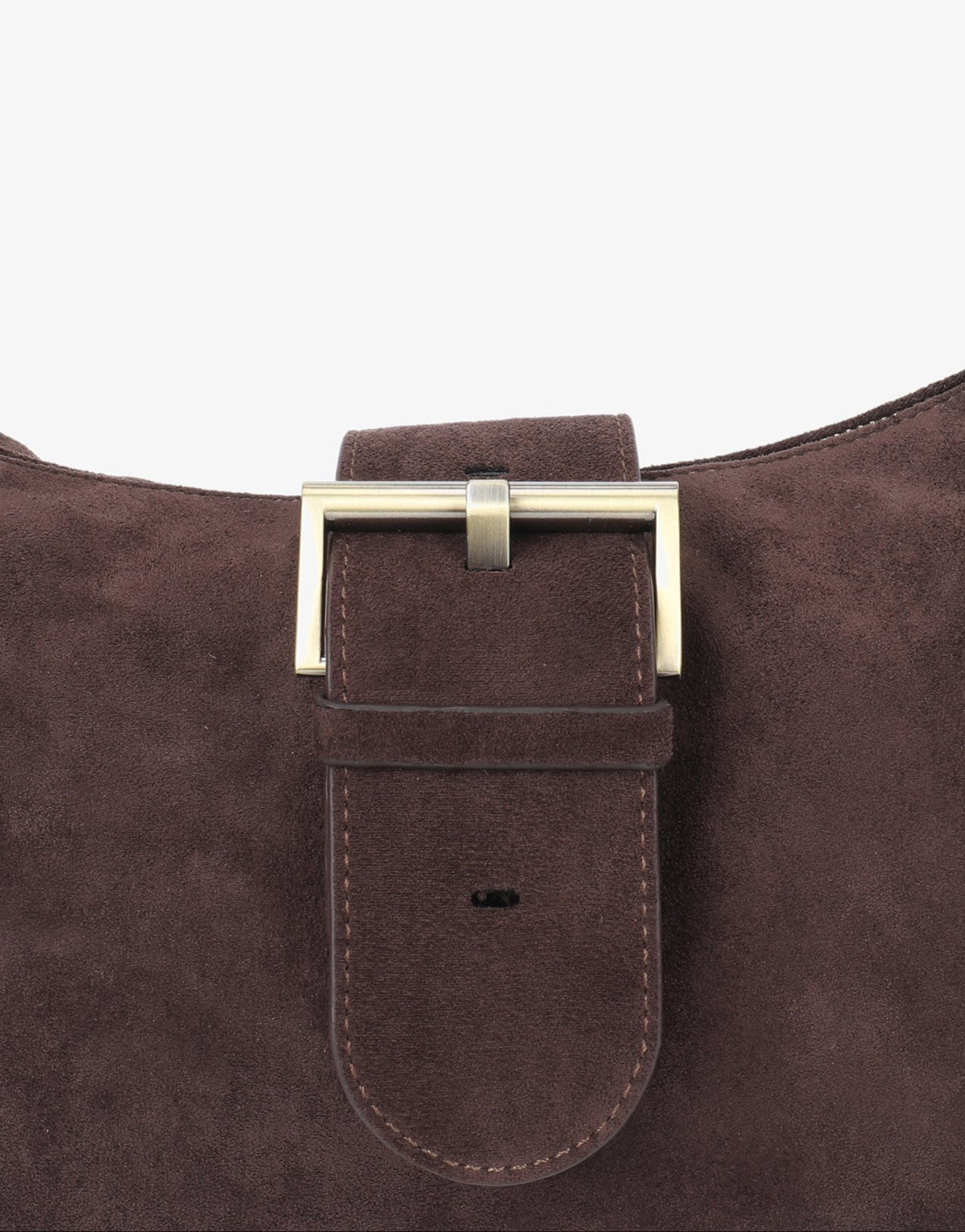 Close-up of a brown faux suede shoulder bag with a gold buckle_Remi and Reid