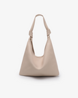 A beige shoulder bag with a knotted strap and a minimalistic design by Remi and Reid.
