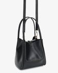 Hollace mini tote in black with detachable, adjustable crossbody strap by Remi and Reid.